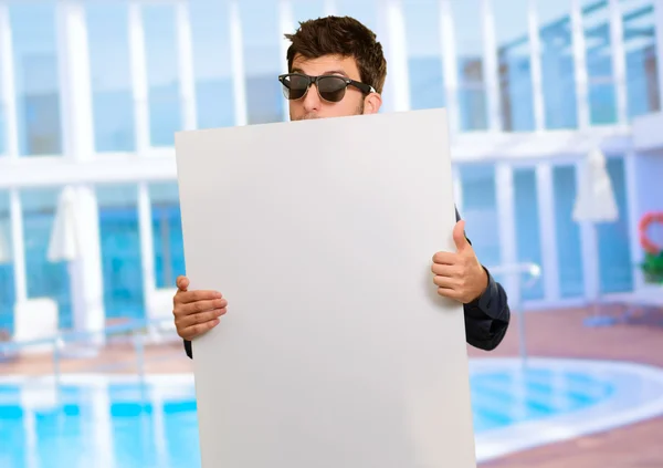 Young Man Holding Banner Wearing Sunglasses — Stock Photo, Image