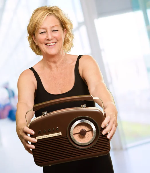 Happy Mature Woman Holding Radio — Stock Photo, Image