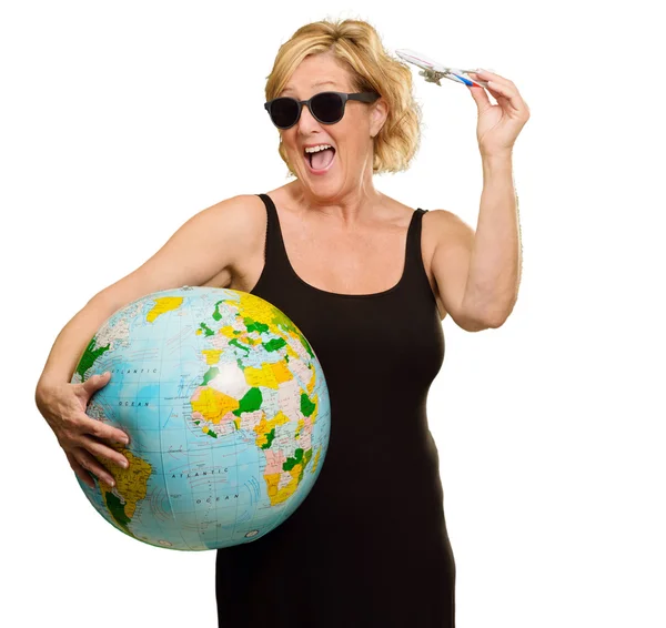 Mature Woman Holding Globe And Miniature Airplane — Stock Photo, Image