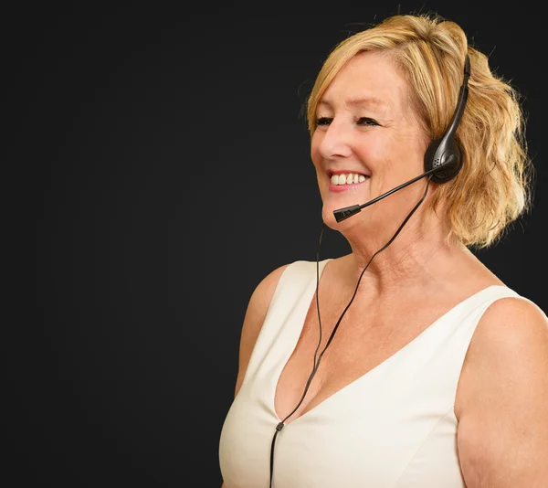 Portrait Of A Mature Woman Wearing Headset — Stock Photo, Image