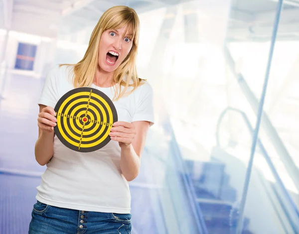 Afraid Woman Holding Dartboard — Stock Photo, Image