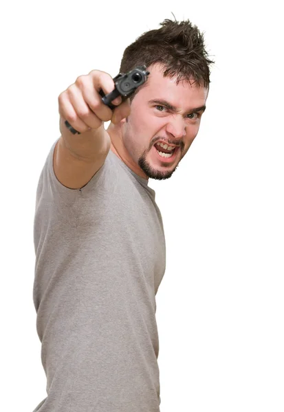 Furious man pointing with gun — Stock Photo, Image