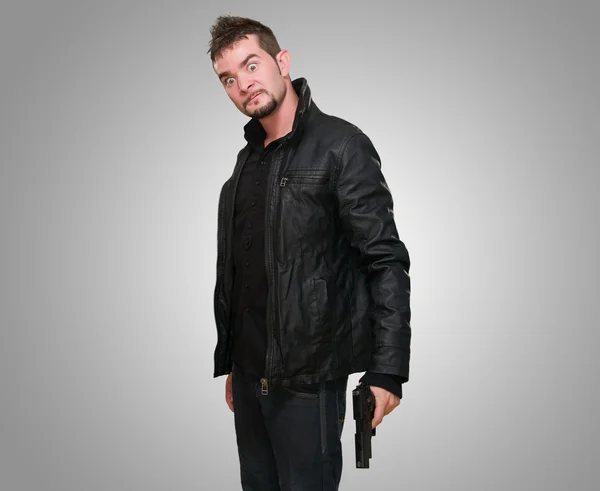 Crazy man holding a gun — Stock Photo, Image