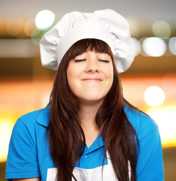 Portrait of a young female chef satisfied — Stock Photo, Image