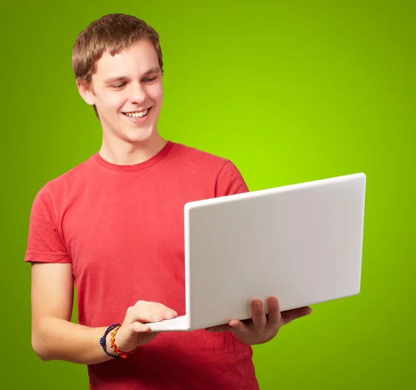 Happy man using laptop Stock Picture