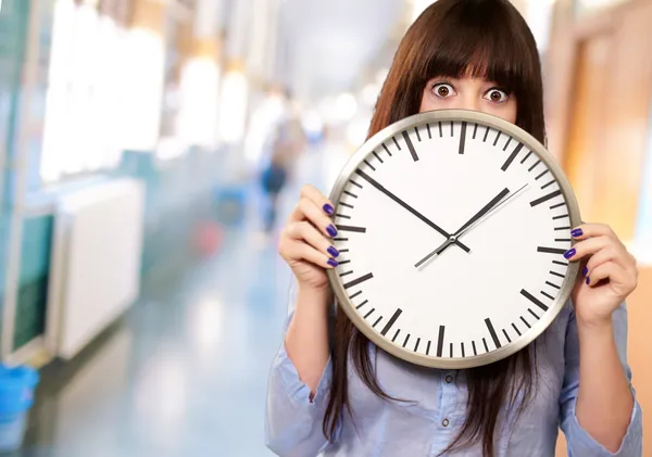 Woman Holding Clock Stock Picture