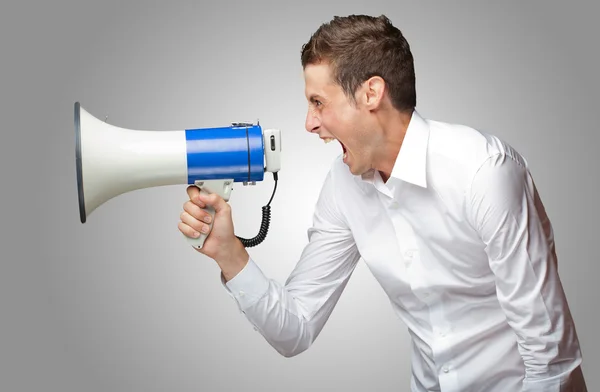 Portrait Of Young Man Shouting On Megaphone — Stock Photo, Image