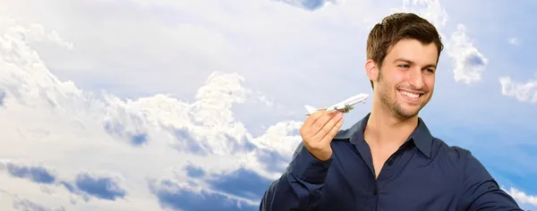 Hombre joven con bandera británica y avión —  Fotos de Stock