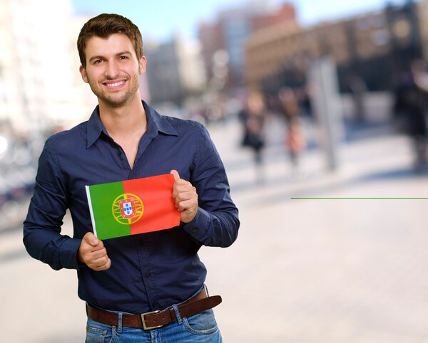Young Man Holding Portuguese Flag