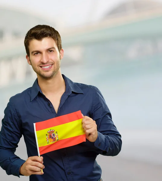 Joven sosteniendo bandera de España —  Fotos de Stock