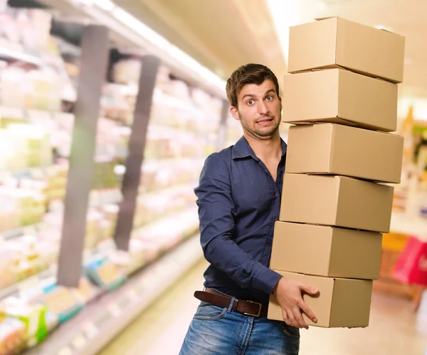 Young Man Holding Stack Of Cardboxes — Stock Photo, Image