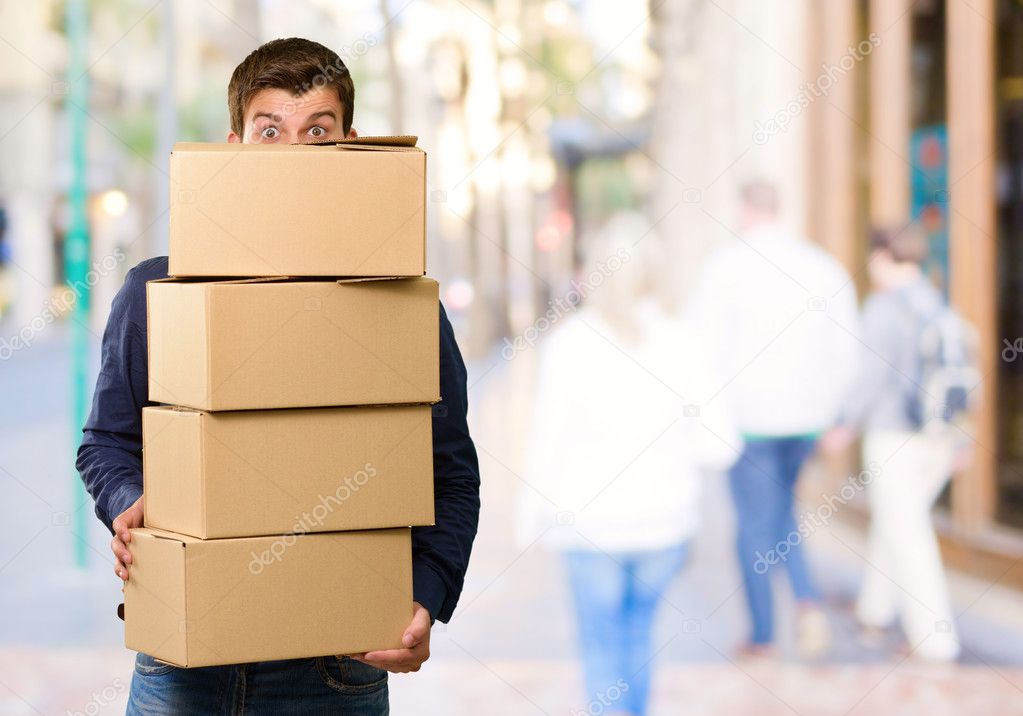 Man holding cardboard boxes