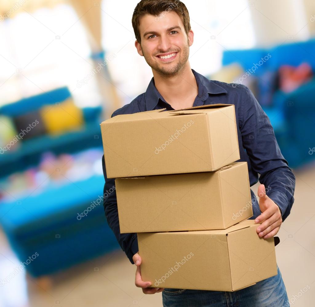 Young Man Holding Cardboxes