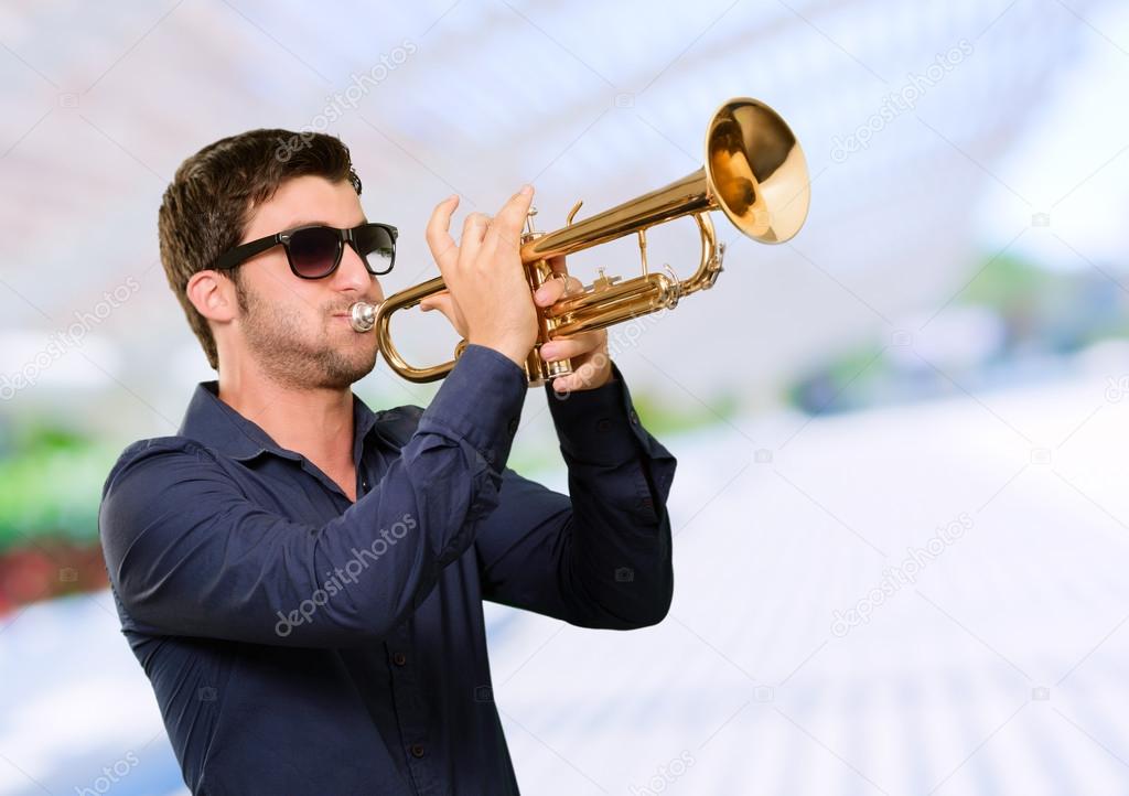 Young Man Holding Trumpet