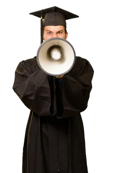 Absolvent muž křičí do megafonu — Stock fotografie