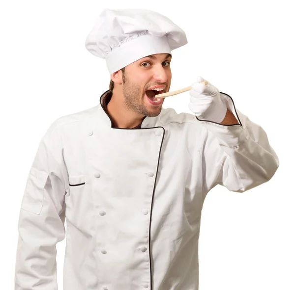 Portret van een chef-kok eten brood stok — Stockfoto