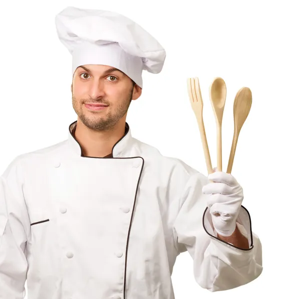 Joven Chef sosteniendo cucharas de madera — Foto de Stock