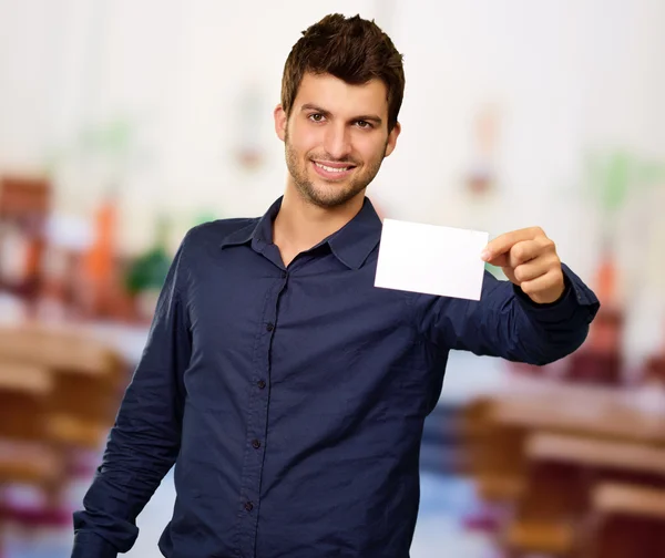 Young Man Holding Blank Visiting Card — Stock Photo, Image