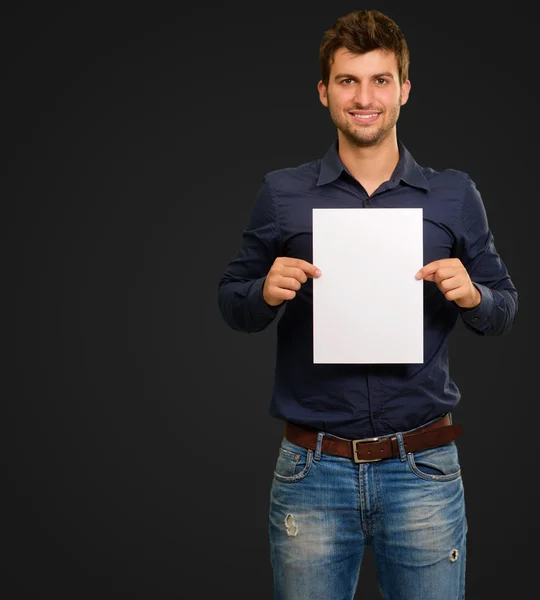 Young Man Holding Blank Paper — Stock Photo, Image