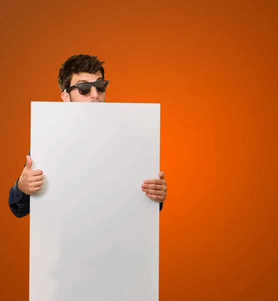 Young Man Holding Banner Wearing Sunglasses — Stock Photo, Image