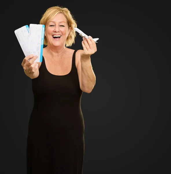 Woman Holding Boarding Pass And Miniature Aeroplane — Stock Photo, Image