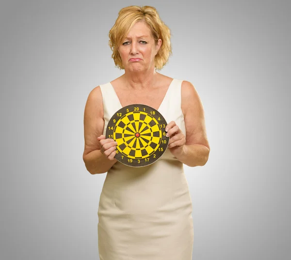 Sad Mature Woman Holding Dart Board — Stock Photo, Image