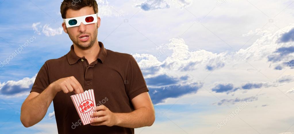 Man Eating Popcorn And Watching 3d Movie