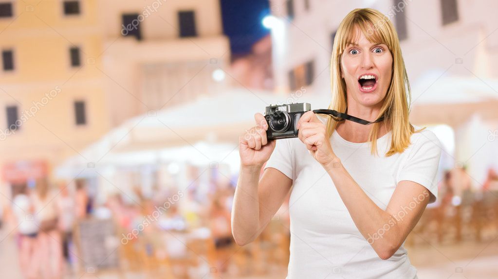 Shocked Woman With Old Camera