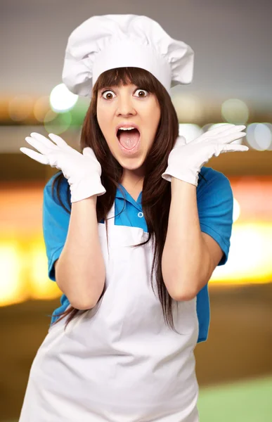 Portrait of female chef surprised — Stock Photo, Image