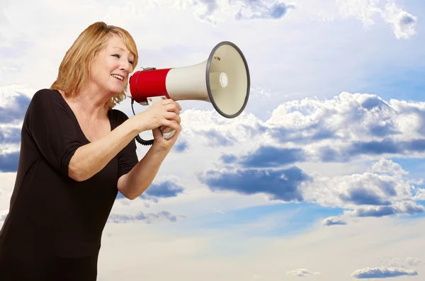 Woman with megaphone Stock Photo