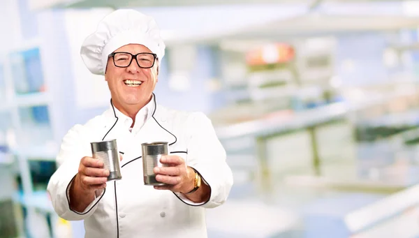 Senior Chef Holding Tin Cans — Stock Photo, Image