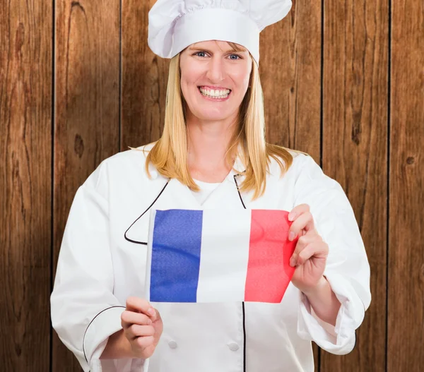 Happy Chef tenant le drapeau français — Photo