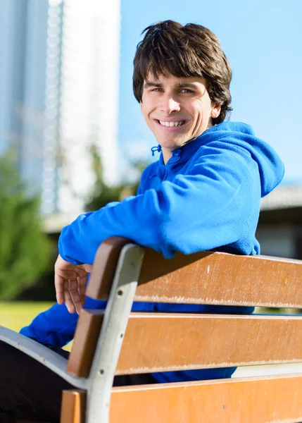 Young Man Sitting On Bench — Stock Photo, Image