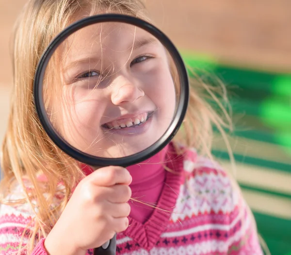 Girl Looking Through Magnifying Glass — Stock Photo, Image