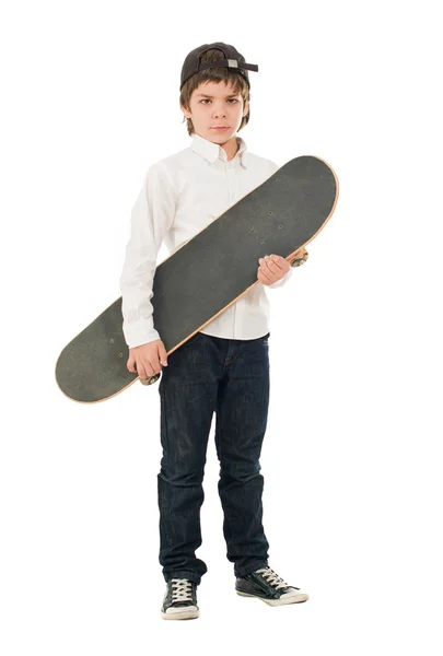 Portrait d'un garçon tenant une planche à roulettes — Photo