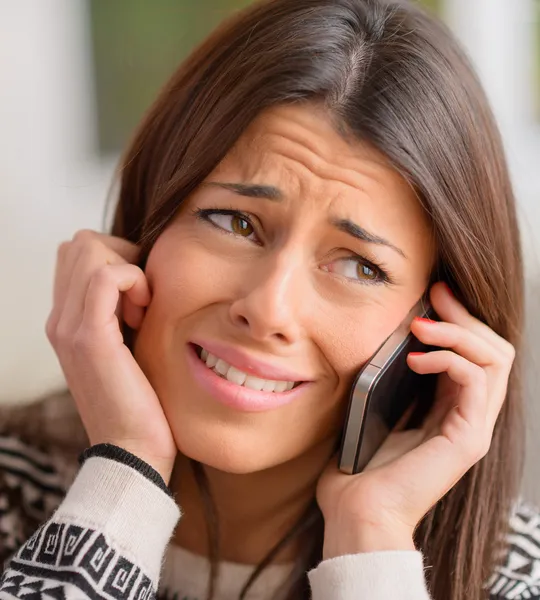 Young Woman Crying On Cell Phone Stock Photo