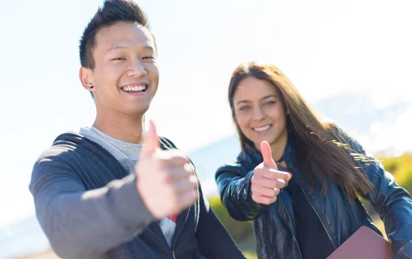 Young Couple Showing Thumb Up Sign — Stock Photo, Image