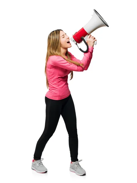 Jovem mulher gritando através de megafone — Fotografia de Stock