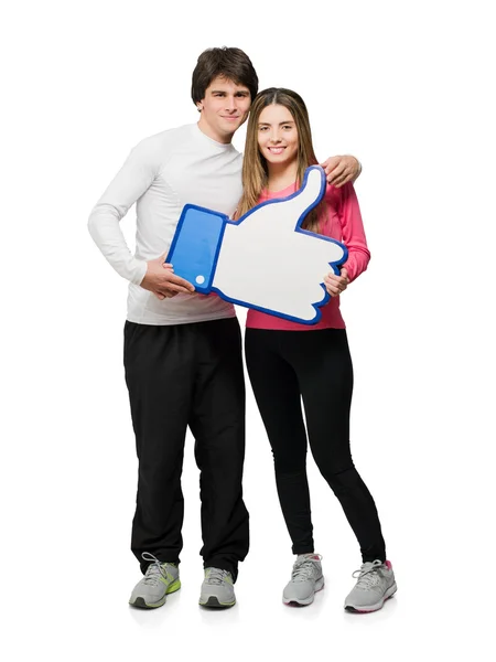 Young Couple Holding Thumb-up Sign — Stock Photo, Image