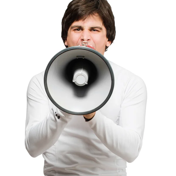 Молодой человек кричит через мегафон — стоковое фото