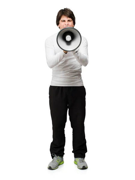 Joven escuchando música y mordiendo un cable sobre fondo blanco — Stockfoto