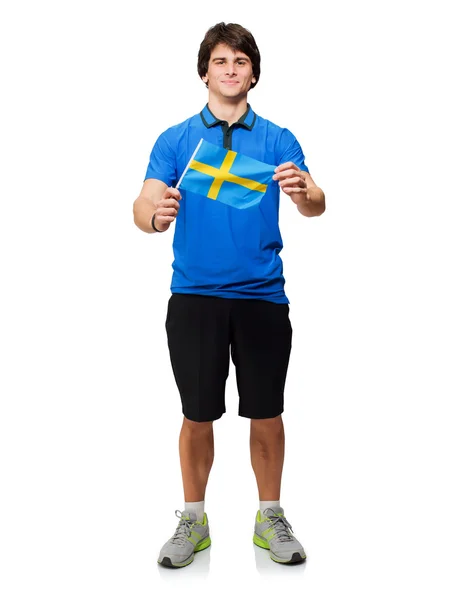 Jonge man bedrijf Zweedse vlag — Stockfoto