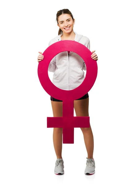 Mujer joven sosteniendo signo femenino — Foto de Stock