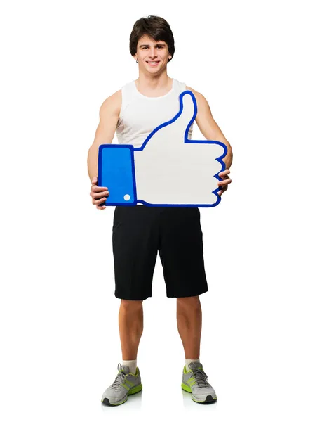 Jonge man met thumbs-up teken — Stockfoto