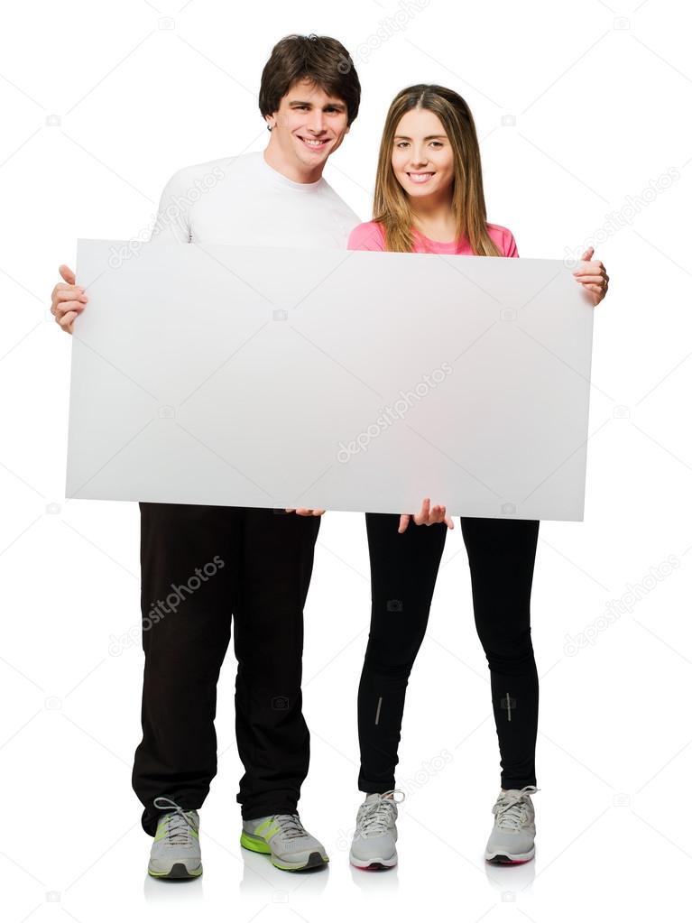 Happy Young Couple Holding Blank Placard