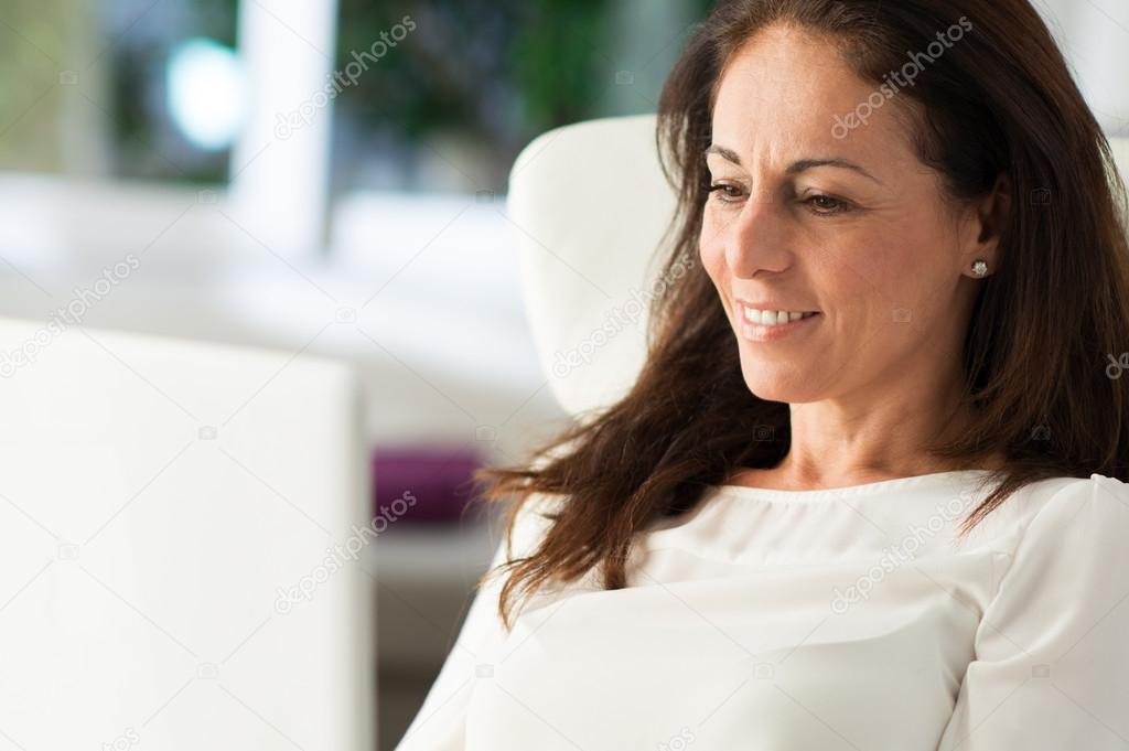 Happy Mature Woman Working On Laptop