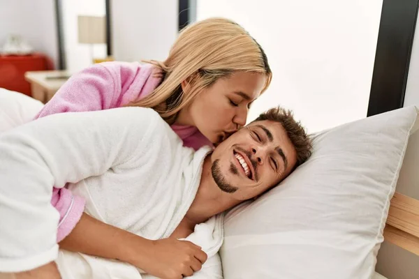 Young Caucasian Couple Kissing Hugging Lying Bed Home — Foto Stock