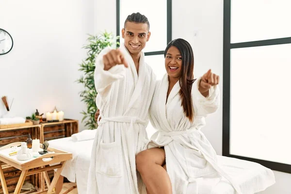 Young Latin Couple Wearing Towel Standing Beauty Center Pointing You — Foto Stock