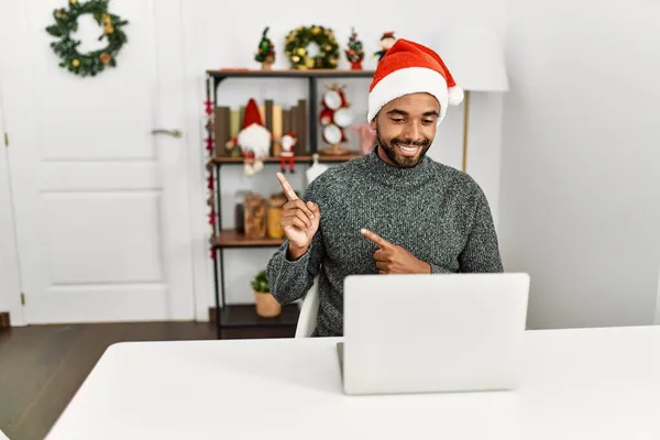 Young Hispanic Man Beard Wearing Christmas Hat Using Laptop Smiling — Stock Photo, Image