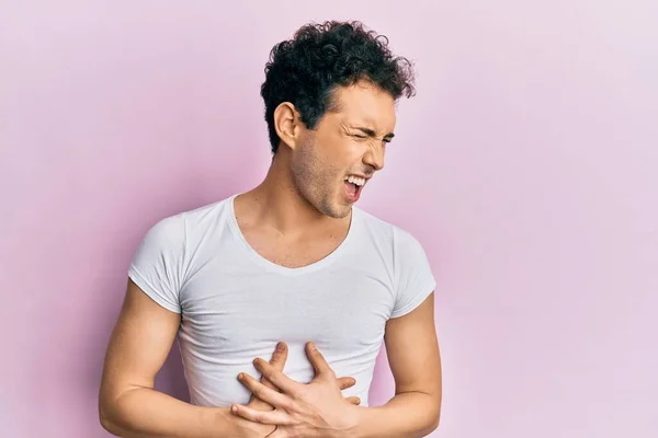 Joven Hombre Guapo Con Camiseta Blanca Casual Con Mano Estómago —  Fotos de Stock